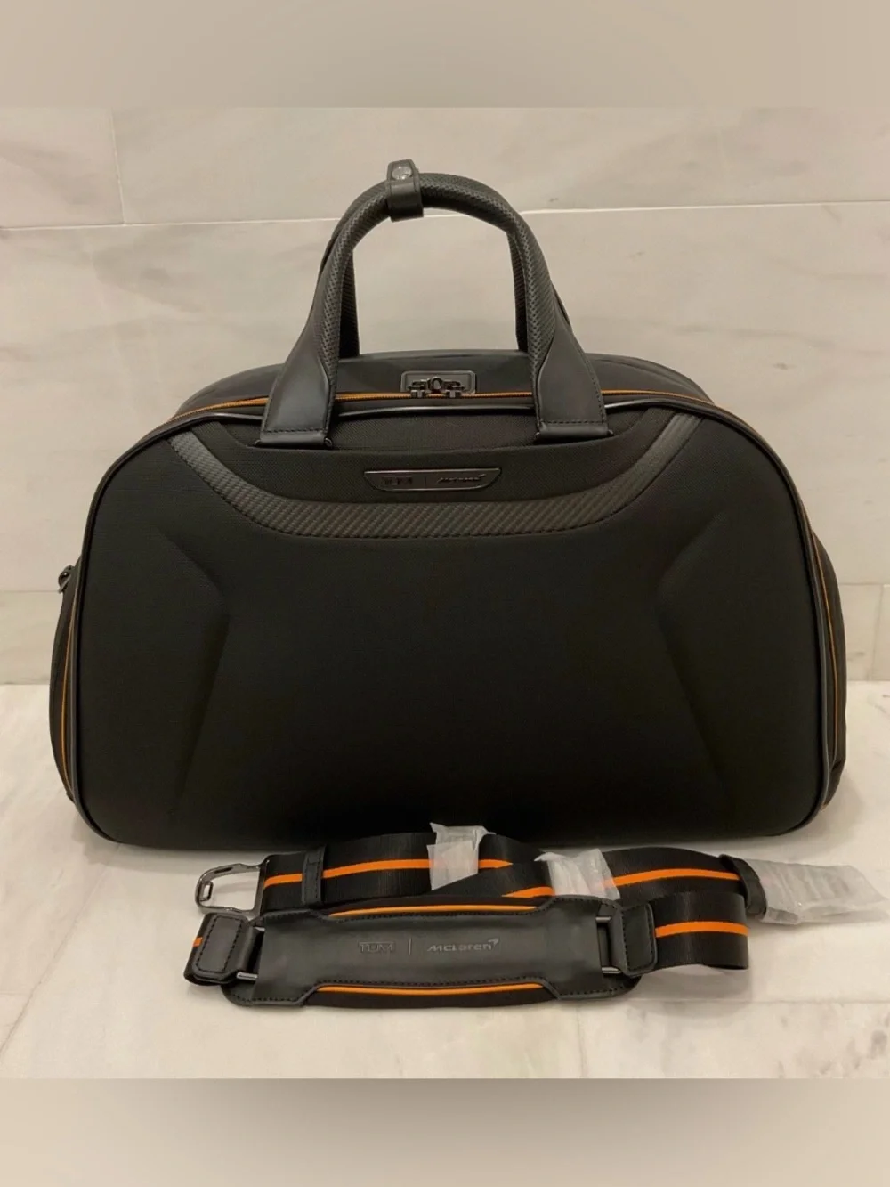 NEW Tumi McLaren QUANTUM 21.5” Duffel Bag - BLACK with PAPAYA ORANGE Accents